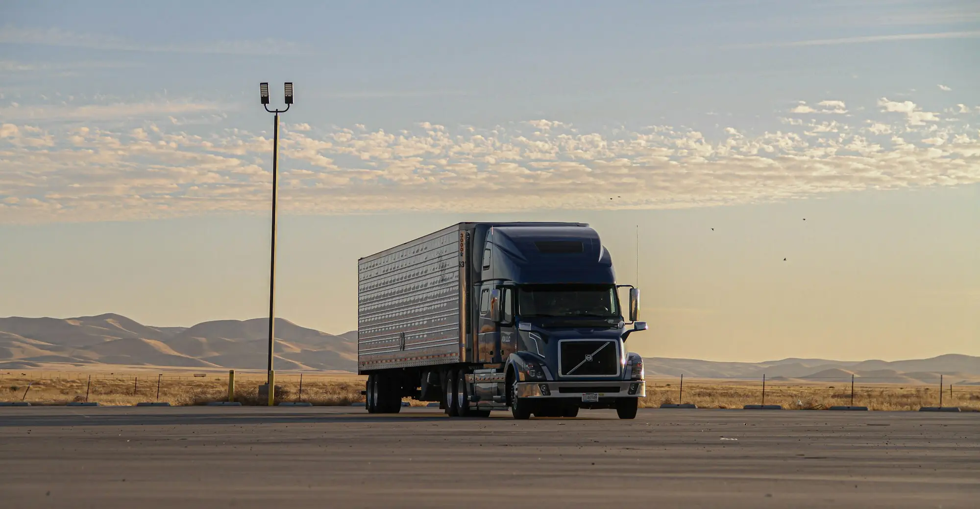 Black work vehicle on an open road, the type of business vehicle bought with vehicle finance
